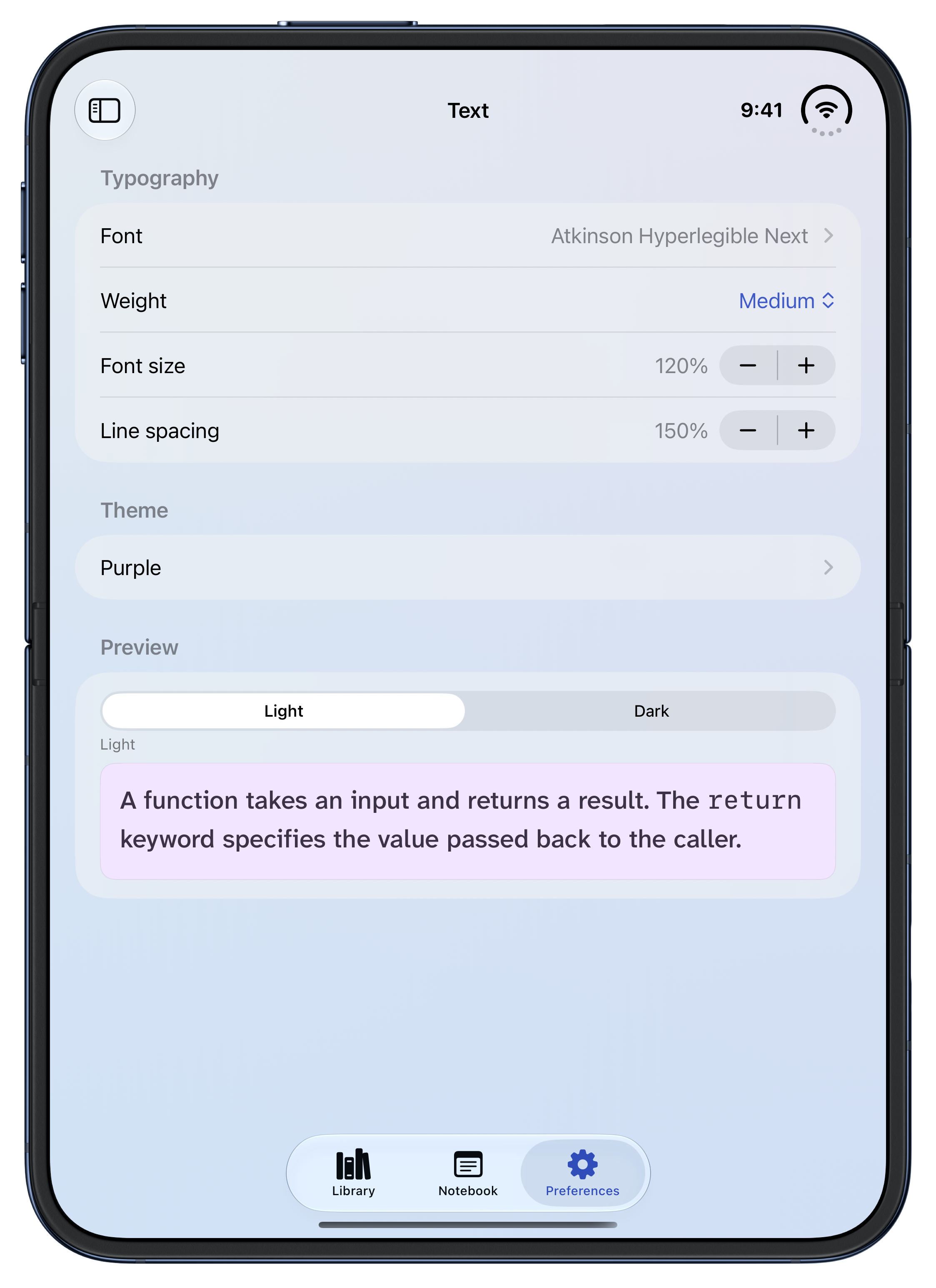 Whio text preferences on an open iPhone Duo in light appearance, showing the Atkinson Hyperlegible Next font, medium weight, 120 percent font size, 150 percent line spacing, and a preview of the Purple theme.