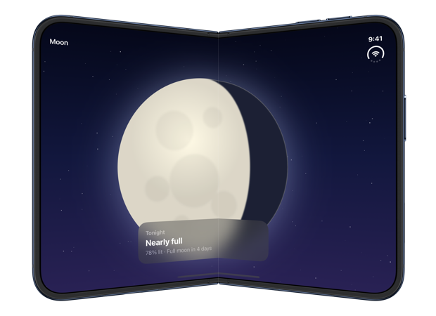 The partially folded inner display of iPhone Duo with the card still layered over the moon, both lying across the fold